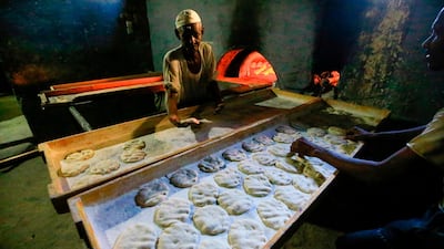 Sudanese bakers prepare bread at a bakery in the town of Atbara, an industrial town 350 kilometres northeast of Sudan’s capital Khartoum. AFP