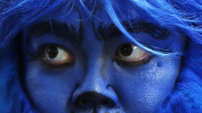 A fan dressed as X-Men character Beast waits for cast members at the South East Asia premiere of X-Men: Days Of Future Past in Singapore 14 May, 2014. Reuters