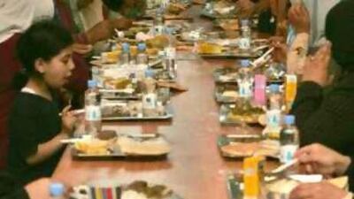 Jordanians meet for the iftar or breaking fast meal provided by a charity in Amman.