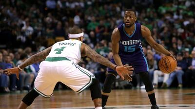Kemba Walker #15 of the Charlotte Hornets handles the ball against Isaiah Thomas #4 of the Boston Celtics in the first half at TD Garden on April 11, 2016 in Boston, Massachusetts. (Mike Lawrie/Getty Images/AFP)