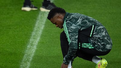Real Madrid's Vinicius Junior ties his laces during a training session held at Anfield. EPA