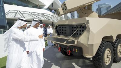 Sheikh Mohammed looks at a Nimr military vehicle. Ryan Carter / Crown Prince Court - Abu Dhabi