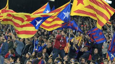 Barcelona supporters wave Estelada flags for the independence of Catalonia, during the La Liga match against Eibar at the Camp Nou on Sunday. Andreu Dalmau / EPA