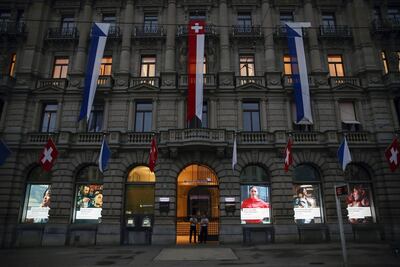 Security guards stand at the entrance to Credit Suisse's headquarters in Zurich. The company has recently become embroiled in a spying scandal involving an employee who was leaving to join rival Swiss bank UBS. Bloomberg