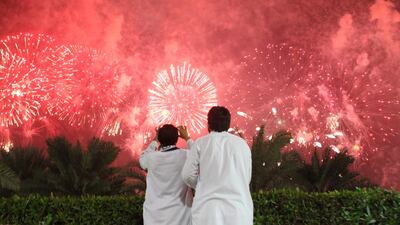 Crowds watch in awe as fireworks were set off along the Abu Dhabi corniche in celebration of the nation's 42nd anniversary. Mona Al-Marzouqi / The National