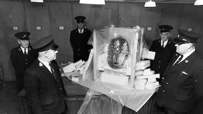 British Museum guards come face to face with ancient death mask of Tutankhamun, in 1972.