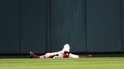 St. Louis Cardinals' Dexter Fowler is injured after hitting the wall during a baseball game at Busch Stadium. Bill Boyce / AP Photo