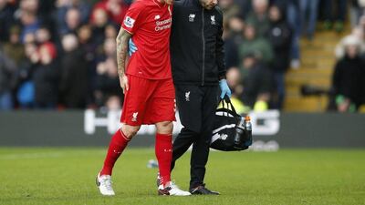 Martin Skrtel leaves the pitch during the Watford defeat with a hamstring injury. John Sibley / Reuters