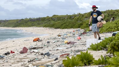 James Beard picking up rubbish on East beach. Iain McGregor/STUFF