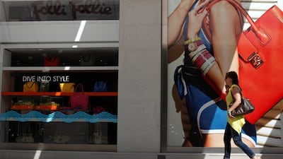 Women's handbags inside a Folli Follie store in Athens, Greece. The company is under pressure following a series of allegations regarding its financials. Kostas Tsironis/Bloomberg