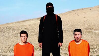 FILE — This file image taken from an online video released by the Islamic State group’s Al-Furqan media arm on Tuesday, Jan. 20, 2015, purports to show the group threatening to kill two Japanese hostages that the militants identify as Kenji Goto Jogo, left, and Haruna Yukawa, right, unless a $200 million ransom is paid within 72 hours. Japan’s government is investigating a new message purported to be from the Islamic State group Saturday, Jan. 24, 2015 holding two Japanese hostages. the Associated Press could not verify the contents of the message, which varied greatly from previous videos released by the Islamic State group, which now holds a third of both Syria and Iraq. (AP Photo, File)