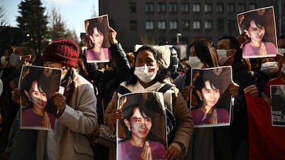 A group of Myanmar activists hold the portrait of Aung San Suu Kyi during a protest outside the United Nation university in Tokyo following a military coup in the country by a general after arresting civilian leader Aung San Suu Kyi and other senior officials. AFP