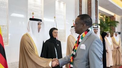 Dr Thani Al Zeyoudi, UAE Minister for Climate Change and Environment (L) greets Emmerson Mnangagwa, President of Zimbabwe (R), during a reception at the Presidential Airport. Ryan Carter for the Ministry of Presidential Affairs