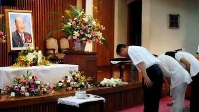 Followers pay respect to the Rev. Sun Myung Moon at a Unification Church in Tokyo.