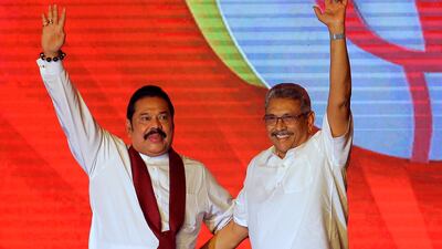 Mahinda Rajapaksa, left, and his brother Gotabaya Rajapaksa at a 2019 party convention in Colombo. AP Photo