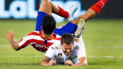 Diego Costa, left, collides with Real Madrid's Eden Hazard. EPA