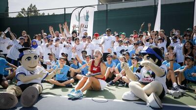 Latisha Chan with mascots Ace and Annette at the Lacoste Special Needs Clinic