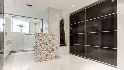 The mezzanine level has the main bedroom, a walk-in closet and a bathroom. Courtesy Luxhabitat