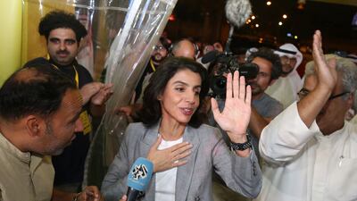 Alia Al Khaled celebrates with her supporters following her victory in Kuwait's parliamentary election. AFP