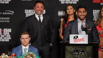 Amir Khan, right speaks as Saul Alvarez looks on during their final press conference at the MGM Grand in Las Vegas. John Gurzinski / AFP
