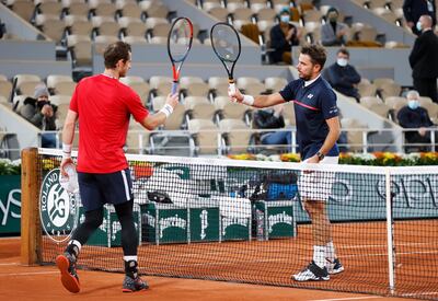 Stan Wawrinka greets Andy Murray at the net after his one-sided win in the French Open first round. Getty Images