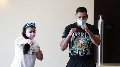Amir Khan posing for the photo with Anoushka Tandon. Pawan Singh / The National