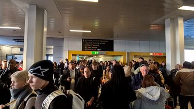 Crowds of passengers as Gatwick Airport's south terminal is evacuated. PA
