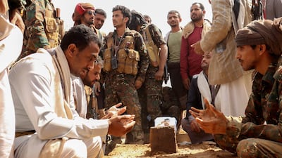 Mourners gather by the grave of Brig Gen Abdul Ghani Shaalan, commander of Special Security Forces in Marib, Yemen, who was killed in fighting with Houthi rebels in February. Reuters.