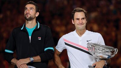 Roger Federer, right, could surpass Andre Agassi, who held the No 1 spot in 2003 aged 33 years and 131 days. Dita Alangkar / AP Photo