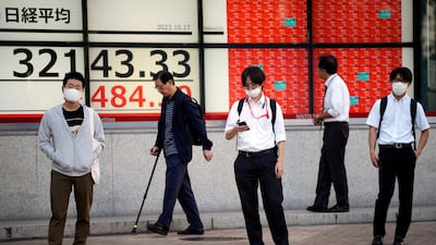In Tokyo, an electronic stock board shows Japan's Nikkei 225 index, which ended the week lower in line with its regional and global peers counterparts. AP