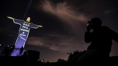 Christ the Redeemer with a projection in tribute to the victims of Covid-19 that reads 'More than 500 thousand lives', in Rio de Janeiro, Brazil. EPA