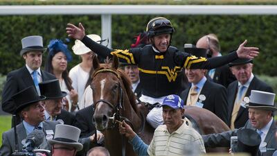 Frankie Dettori celebrates in the parade ring after riding Undrafted to the win in the Diamond Jubilee Race at Royal Ascot for American trainer Wesley Ward. Will Oliver / EPA