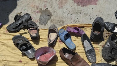 Abandoned shoes belonging to Afghan victims of a suicide bombing lie at the scene of the attack outside a voter registration centre in Kabul on April 22, 2018. Shah Marai / AFP