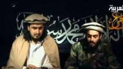 Honman Khaleel Abu Mallal Balawi, right, who blew himself up in Afghanistan, reads a statement as he sits next to Taliban leader Baitullah Mehsud in a video broadcast yesterday.