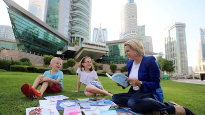 Annemieke Woodbridge with her son Chase and daughter Bella who are also authors. Chris Whiteoak / The National
