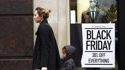A shop front displays its Black Friday sales in Oxford Circus in London, England. Shoppers Look For Bargains On Black Friday. Getty Images