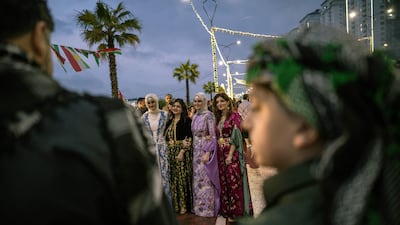 People celebrate Nowruz while wearing traditional costumes in Sulaimaniyah of Iraq's autonomous Kurdish region. AFP