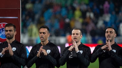 Israel's players sing their national anthem ahead of the Euro 2024 Group I qualifier against Kosovo. AFP