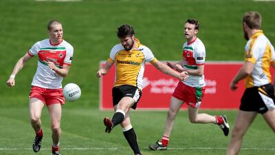 Team Middle East 1, in yellow, plays against team Canada 2 in the Gaelic football tournament during the GAA World Games at Zayed Sports City in Abu Dhabi on March 6, 2015. Christopher Pike / The National