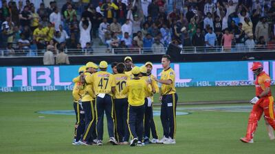 Peshawar Zalmi players celebrate a wicket against Islamabad United in their Pakistan Super League T20 match on Friday. Photo Courtesy / PSL