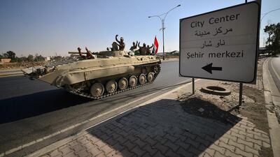 A convoy of armoured vehicles from Iraq's counter-terrorism forces seized the provincial government headquarters in the centre of Kirkuk, less than a day after the operation began. Reuters