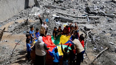 Palestinian children participate in an activity to support the mental health of youths affected by the fighting in Gaza. Reuters