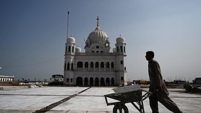 A man works on the construction site at the Sikh religious site Gurdwara Darbar Sahib, in the Pakistani town of Kartarpur near the Indian border. AFP