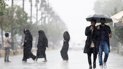 Men use an umbrella during rain in Riyadh, Saudi Arabia, February 16, 2017. Reuters