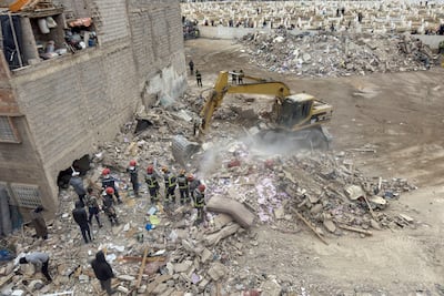 Rescuers work at the site of the two collapsed buildings in Fez. Reuters