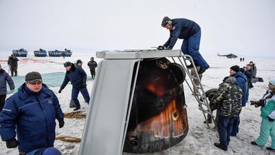 A Search and rescue team works at the landing site of the Soyuz MS-06 space capsule with International Space Station crew members Joe Acaba and Mark Vande Hei of the US, and Alexander Misurkin of Russia in a remote area outside the town of Dzhezkazgan (Zhezkazgan), Kazakhstan. Alexander Nemenov / Reuters