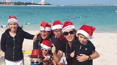 Friends and family of the Feghaly family gather at the Corniche public beach in Abu Dhabi for the family’s second annual sand man building contest on Saturday. The contest is organised by Lebanese lawyer Dunya Feghaly as a means of continuing her family holiday traditions in the UAE, where the Feghalys have lived for more than a decade. The families who built the five most creative sand men were awarded prizes. Dunya and Roger Feghaly pose with the sandman they built with the help of their three children, Yara, Ralph and Romy, and nephew Chris Hokayem. Courtesy Dunya Feghaly