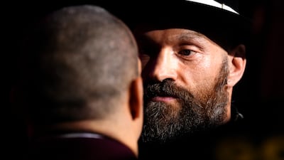 Britain's Tyson Fury and Ukraine's Oleksandr Usyk face off. AFP
