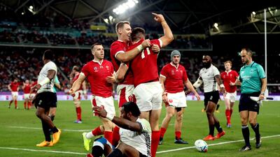 Wales' Josh Adams celebrates scoring his sides third try with his team mates during the 2019 Rugby World Cup Pool D match at Oita Stadium. PA Photo