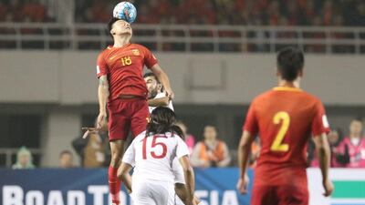 Gao Lin, Ren Hang of China and Alaa Al Shbli of Syria in action. Stringer / Reuters